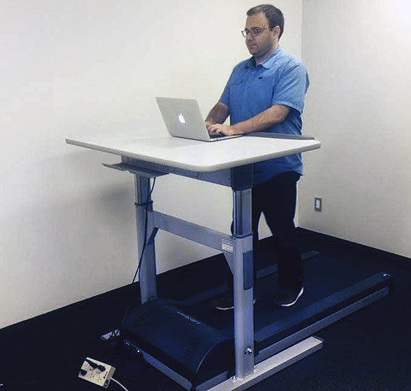 David Silverberg using a LifeSpan treadmill desk